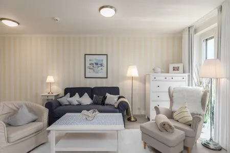 Ferienwohnung Dünensand Zingst Wohnzimmer mit Blick aufs Sofa  Dünensand