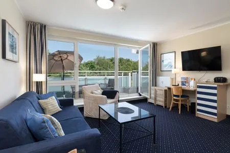 Ferienwohnung Seestern Zingst Wohnzimmer mit Balkon  Seestern