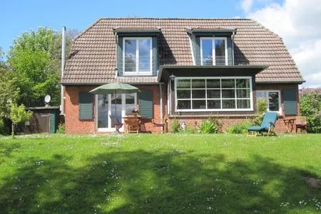 Erleben Sie dieses charmante Haus mit einem einladenden Garten. Haus Horizont