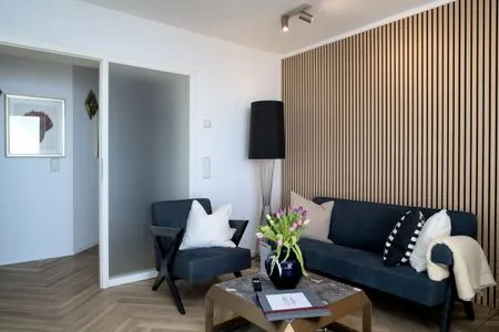 Wohnzimmer FeWo Meerzeit - Balkon, Sauna, Meerblick