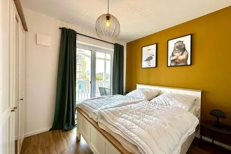 Gemütliches Schlafzimmer ideal für erholsame Nächte. Salt & Sand Haffkrug Salt & Sand Wohnung Sun