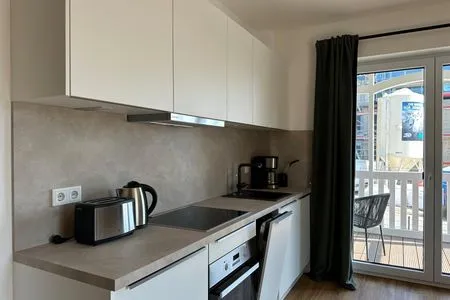 Moderne Küche mit hochwertigen Geräten. Salt & Sand Haffkrug Salt & Sand Wohnung Sun