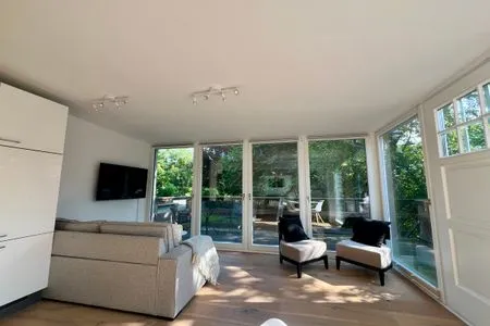 Wohnzimmer Haffperle - Küstenglanz - zentral in Haffkrug, nur wenige Schritte zum Strand