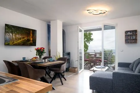 Wohnzimmer FeWo Sonnenschein -  Kamin, Sauna, Meerblick