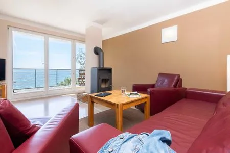 Wohnzimmer FeWo Fontane - Kamin, Sauna, Meerblick, Badeteich