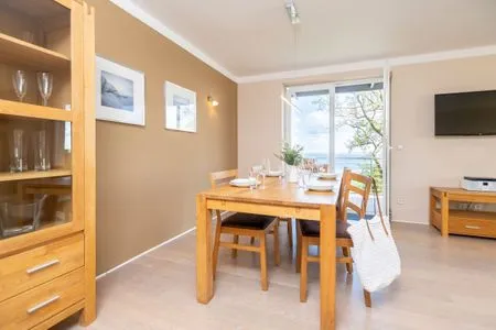 Wohnzimmer FeWo Wellenspiel - Kamin, Sauna, Meerblick
