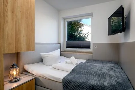 Schlafzimmer FeWo Dwarslöper - Balkon, Sauna, Meerblick