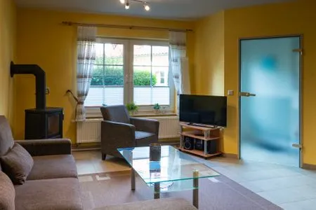 Wohnzimmer mit TV  Am Deich Haus 32