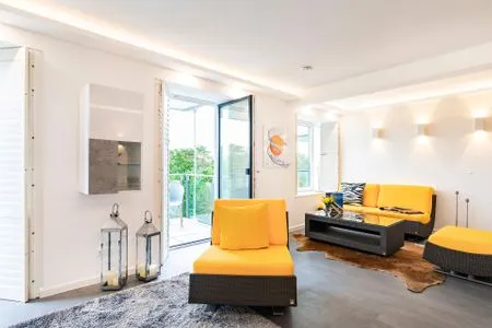 Wohn/Essbereich: TV, Zugang zum Balkon FeWo GiGi in PRORA mit Meerblick | Balkon - 8.42