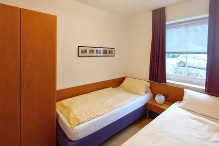 Schlafzimmer in der Ferienwohnung Auszeit am Meer in Wittdün auf Amrum Haus *Südspitze 17* Ferienwohnung *Auszeit am Meer*