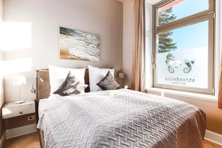 Schlafzimmer Strandvilla Hafenloge - stilvoll wohnen direkt am Niendorfer Hafen