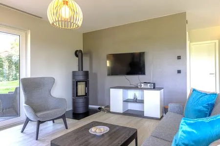 Ferienwohnung Strandflair Ostseebad Wustrow ZweiWasser Alte Seefahrtschule Gemütlicher Wohnbereich mit Kamin  Strandflair