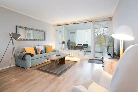 Wohnzimmer Ferienwohnung "StrandPause 52"