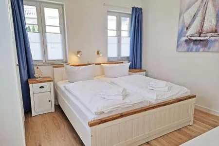 Schlafzimmer Villa Küstenperle, App. Sonnenaufgang - Meerblick pur!