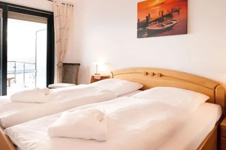 Schlafzimmer Villa Friede-Marie, App. Meeresidyll - mit herrlichem Ostseeblick und Balkon