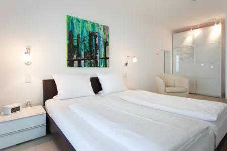 Schlafzimmer Villa Friede-Marie, App. Ariane - mit Balkon und traumhaften Meerblick