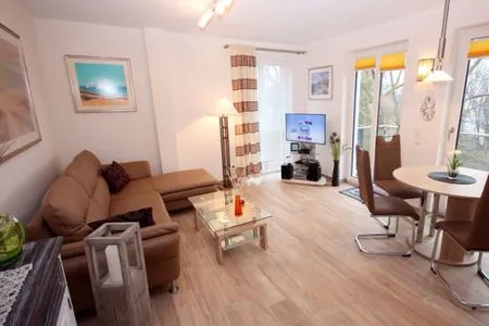 Wohnzimmer Villa Amelie, App. Seestern - mit Balkon und Meerblick