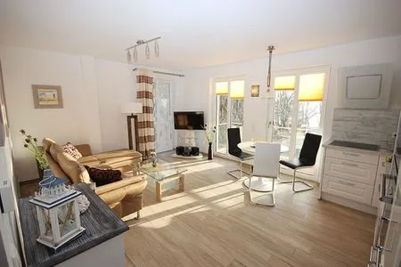 Wohnzimmer Villa Amelie, App. Seemöwe - mit Balkon und Meerblick