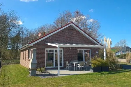 Außenansicht eines Ferienhauses mit Garten Ferienhaus  Deichoase