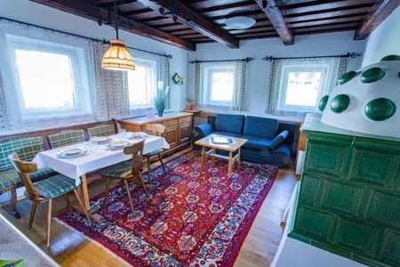 Living room and sofa bed Soldanella 2 by Alpenidyll Apartments