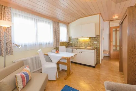 Kitchen with dining area City Life 5 by Alpenidyll Apartments