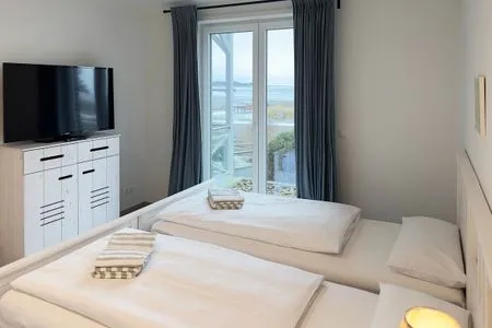 Schlafzimmer Haus *Weiße Düne* Ferienwohnung Weiße Düne 4