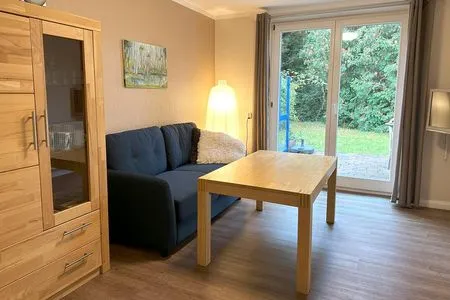 Wohnzimmer mit Zugang zur eigenen Terrasse Haus Kleist Wohnung 3