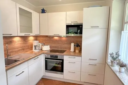 gut ausgestattete Küchenecke Zum Leuchtturm Wohnung 1