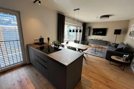 Wohnzimmer, Schlafsofa und Fernseher Mountain Lodge by Alpenidyll Apartments
