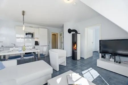 Wohnbereich mit Kamin  de Obendtied - Wohnung 4