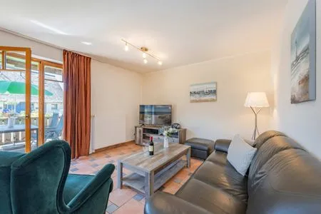 Hauptansicht Ferienwohnung Wassermann mit Terrasse, Sauna und Blick auf das Achterwasser