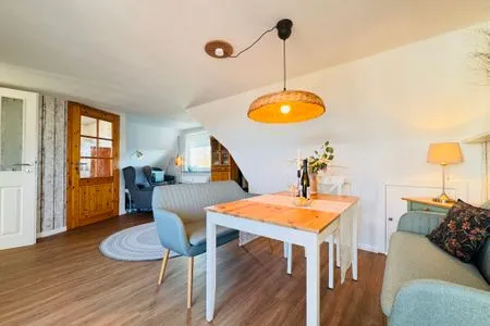 Wohnzimmer mit Essplatz und Meerblick Nordkiek No. 8