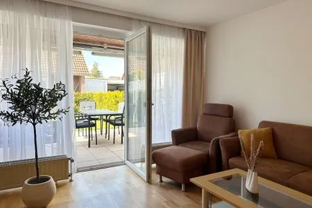 Blick in das Wohnzimmer Küstenperle Haffkrug - dein Platz am Meer