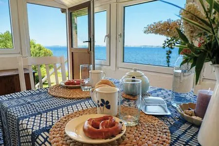 Ausblick vom Essbereich über die Flensburger Förde bis nach Dänemark Ferienhaus Hedwigsblick