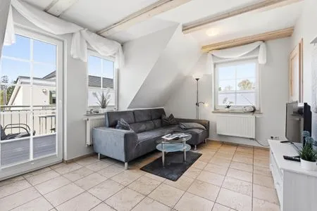 Wohnbereich mit Zugang zum Balkon  Lütt Stuw