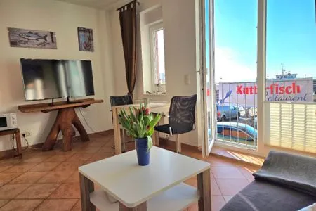 Wohnzimmer Ferienwohnung Kutterfisch - direkt im Stadthafen