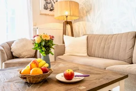 Sofa und Sessel im Wohnbereich  Villa Carpe Diem - Wohnung 2
