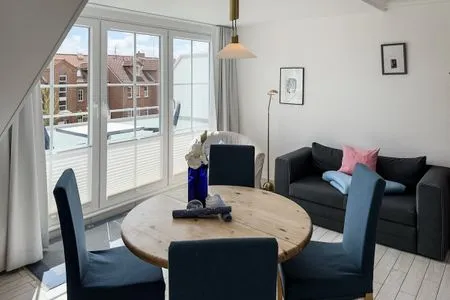 Wohnzimmer Ferienwohnung „Südspitze 10 mit Meerblick"