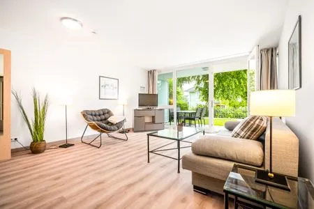 Ferienwohnung Seebär in Zingst - Blick ins Wohnimmer mit Zugang zur Terasse  Seebär