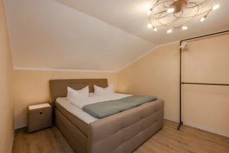 Schlafzimmer Apartment Brücke mit Garten, Sauna & Hot-Tube - nur 500 Meter zum Strand