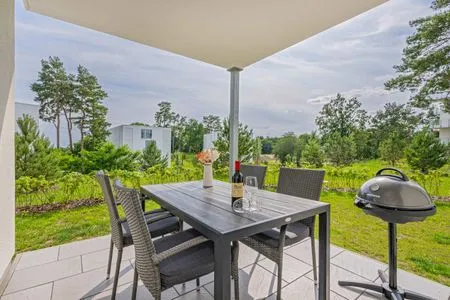 Terrasse Ferienwohnung Haffkoje Fitness, Sauna und Kinderspielbereich