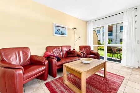 Wohnbereich mit Zugang zur Terrasse Residenz am Strand Wohnung 4-58