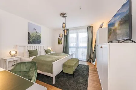 Schlafzimmer Ferienwohnung Ostseebude mit Balkon und nur 800 m zum Strand