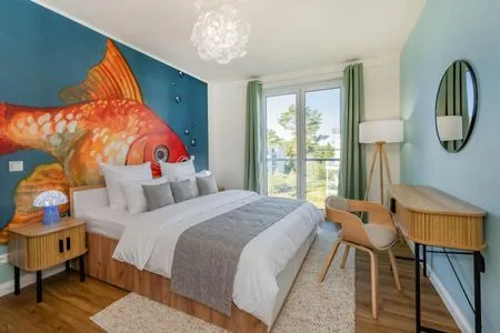 Hauptansicht Ferienwohnung Goldfisch mit Balkon, Wellness- und Kinderspielbereich