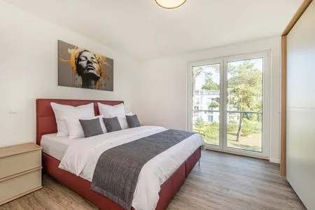 Schlafzimmer Ferienwohnung Pia mit Fitness, Sauna  und Freizeitbereich