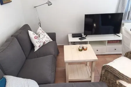 Wohnzimmer mit Sitzecke und TV  Lee