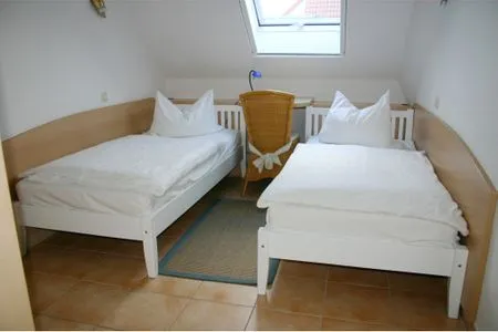 Schlafzimmer mit zwei Einzelbetten Residenz am Strand Wohnung 2-41