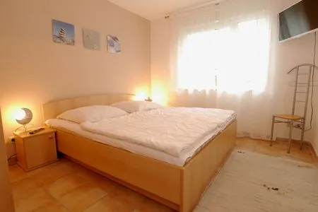 Schlafzimmer mit Doppelbett Residenz am Strand Wohnung 4-58