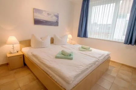 Schlafzimmer mit Doppelbett Residenz am Strand Wohnung 4-61