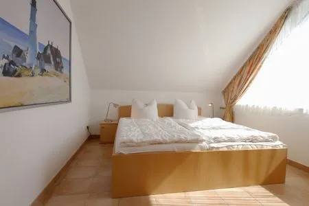 Schalfzimmer mit Doppelbett Residenz am Strand Wohnung 5-71